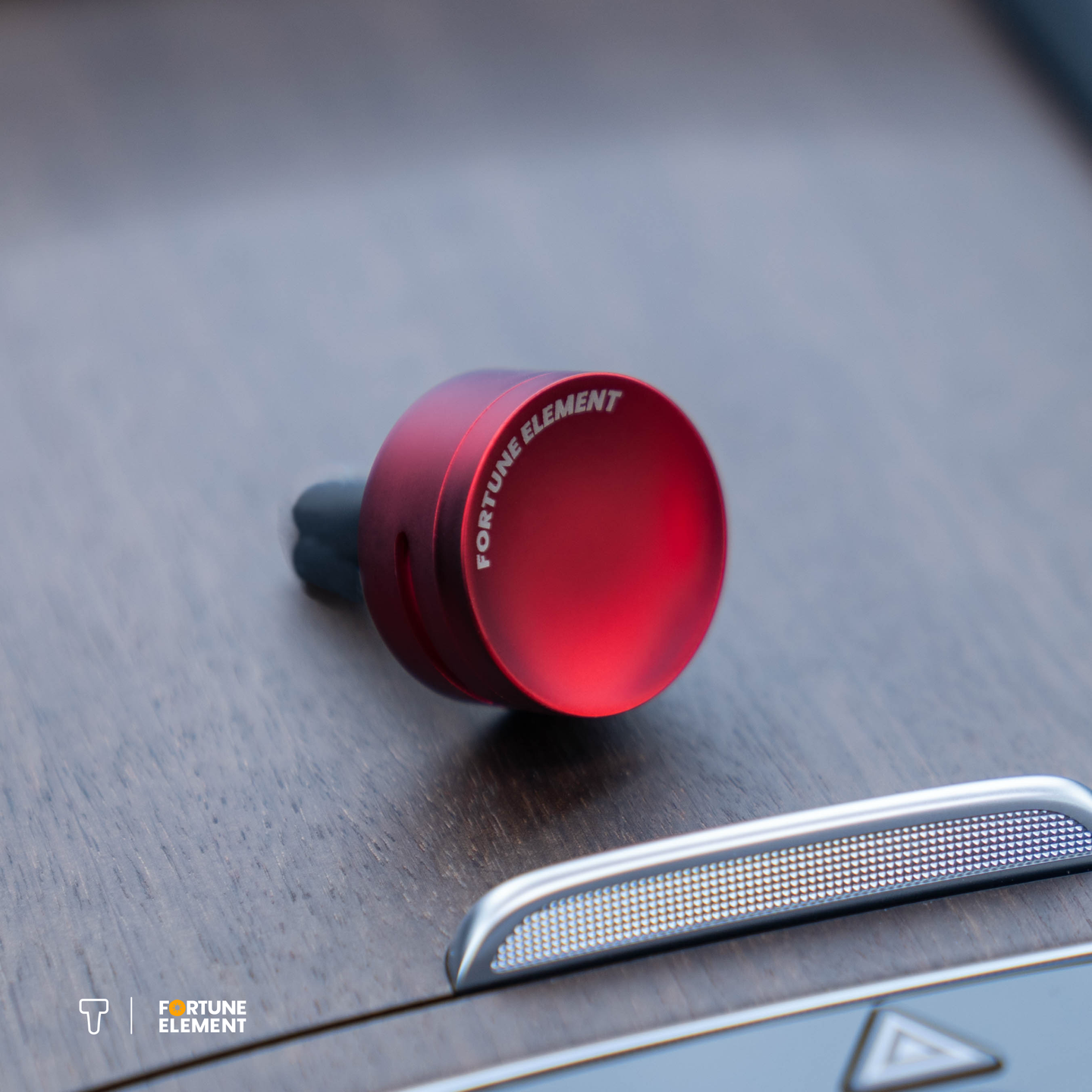 A close-up shot of the car diffuser resting on a wooden surface, showcasing its sleek design and elegant placement.